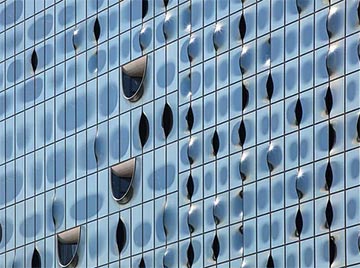 Сложный волнообразный фасад нового впечатляющего концертного зала в Гамбурге создан благодаря продуктам Guardian Glass